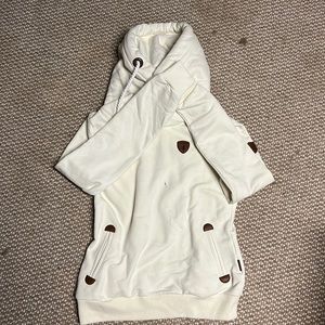 It’s very durable and cream with a hood